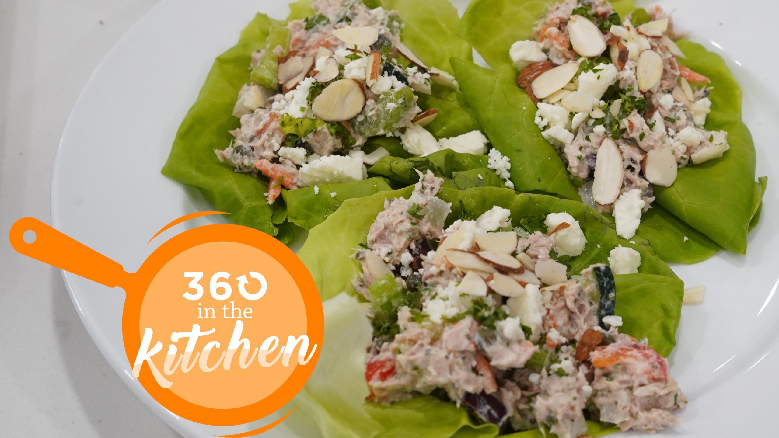 a photo of tuna salad over a bed of green lettuce